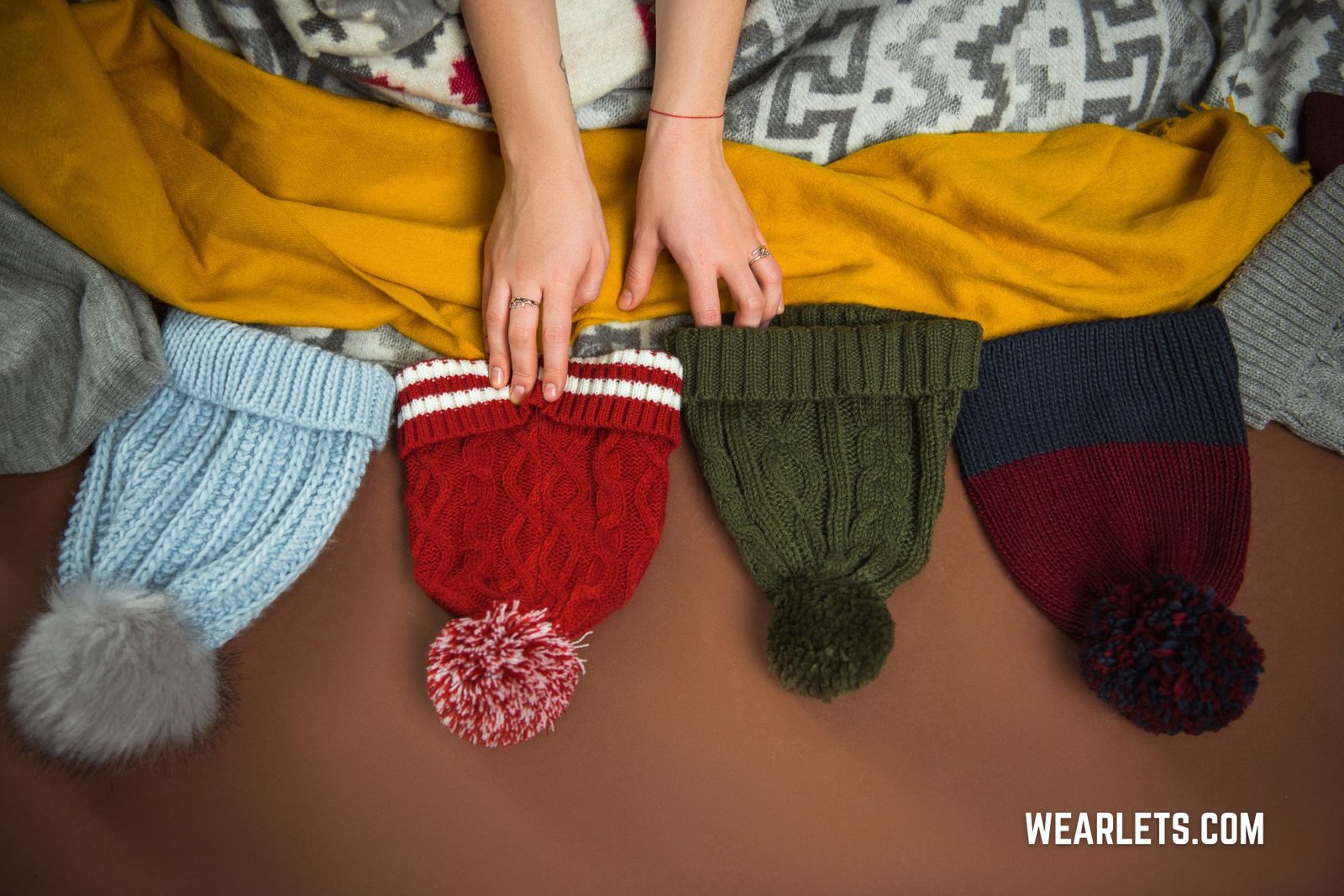 Wearlets custom beanies display — fleece-lined, embroidered, and knitted styles for wholesale and private label clients.