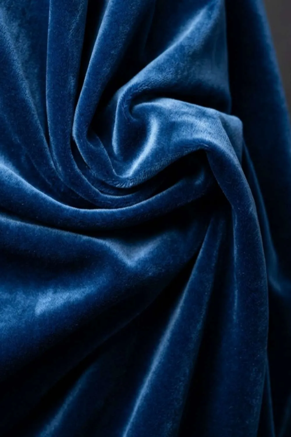 Velvet fabric — dense woven pile textile reflecting light — used in evening and luxury wear