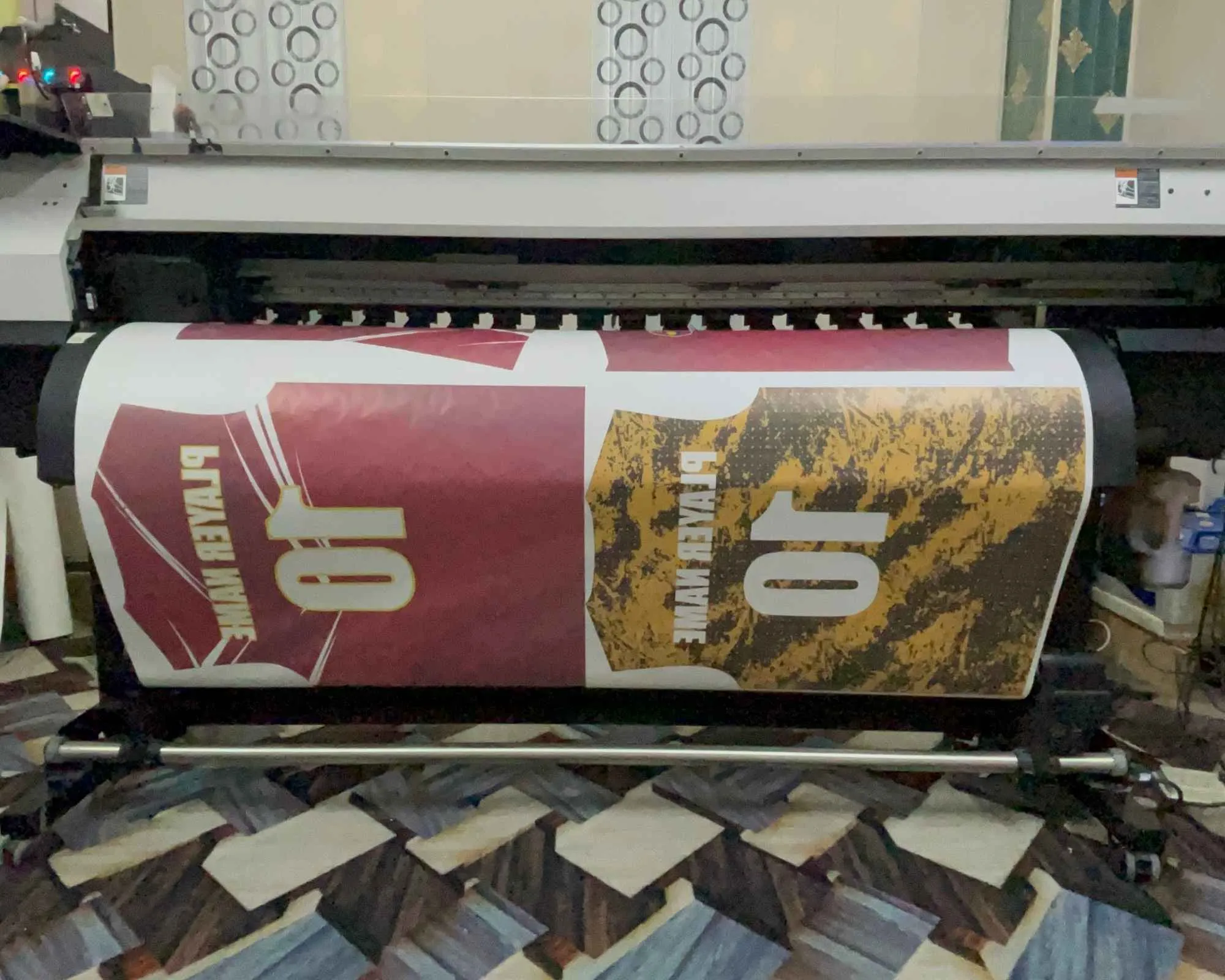 Dye sublimation printing production floor at Wearlets — sublimation printer and heat press in operation