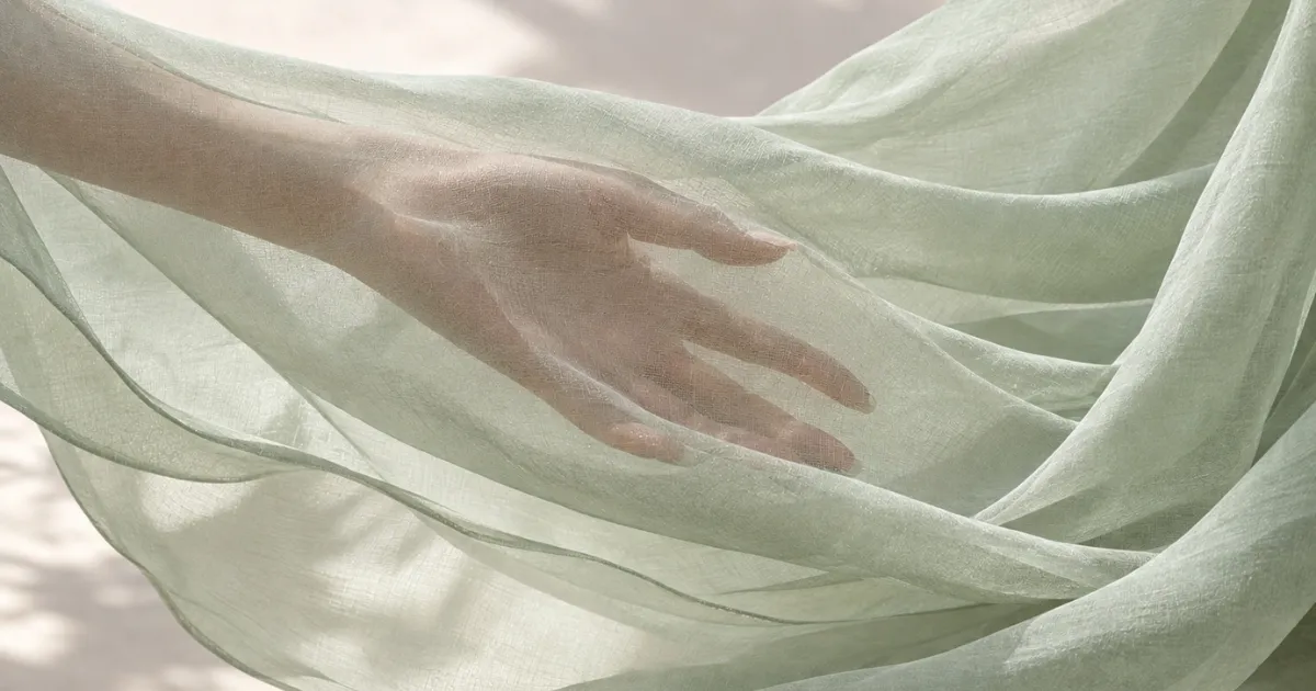Sheer lightweight chiffon fabric draped to show its subtle texture and translucency